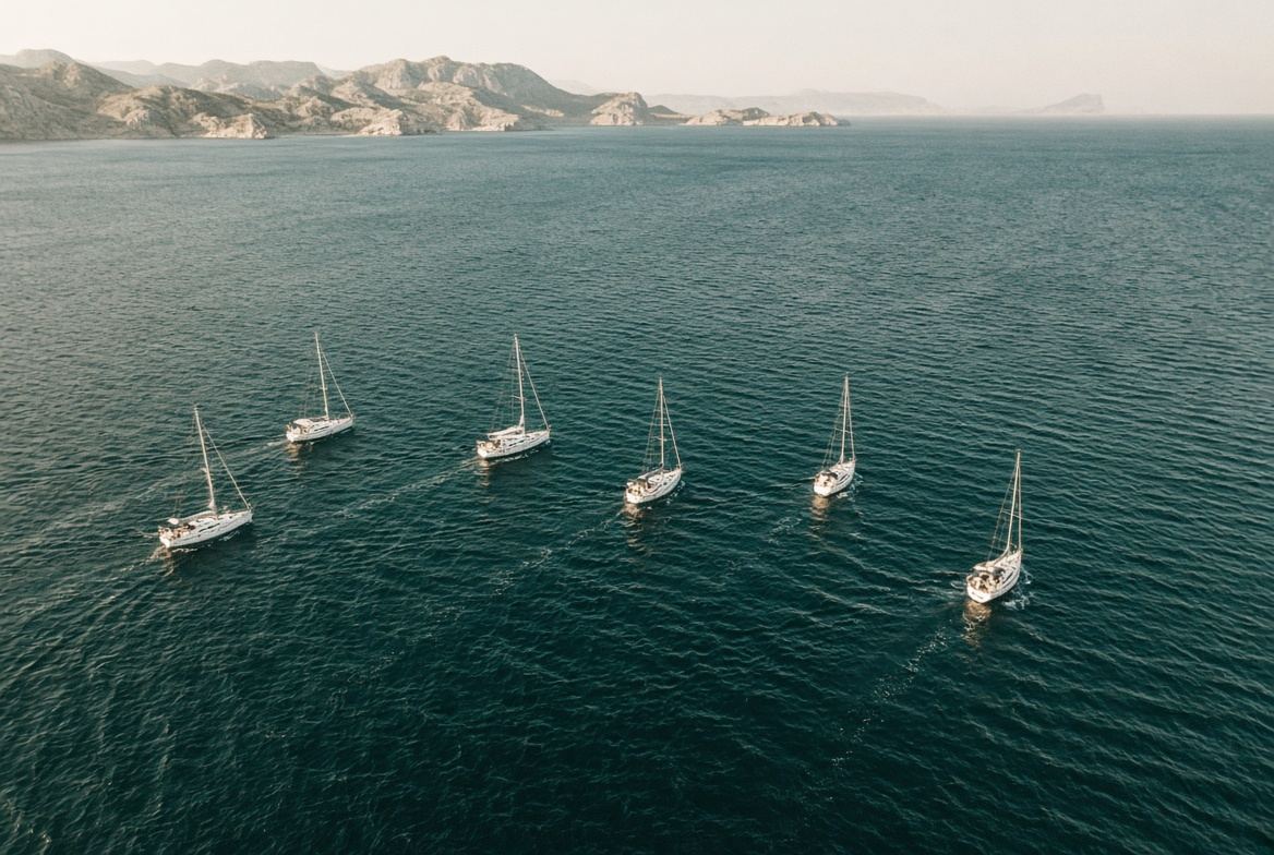 Six sailing yachts on one route in open water
